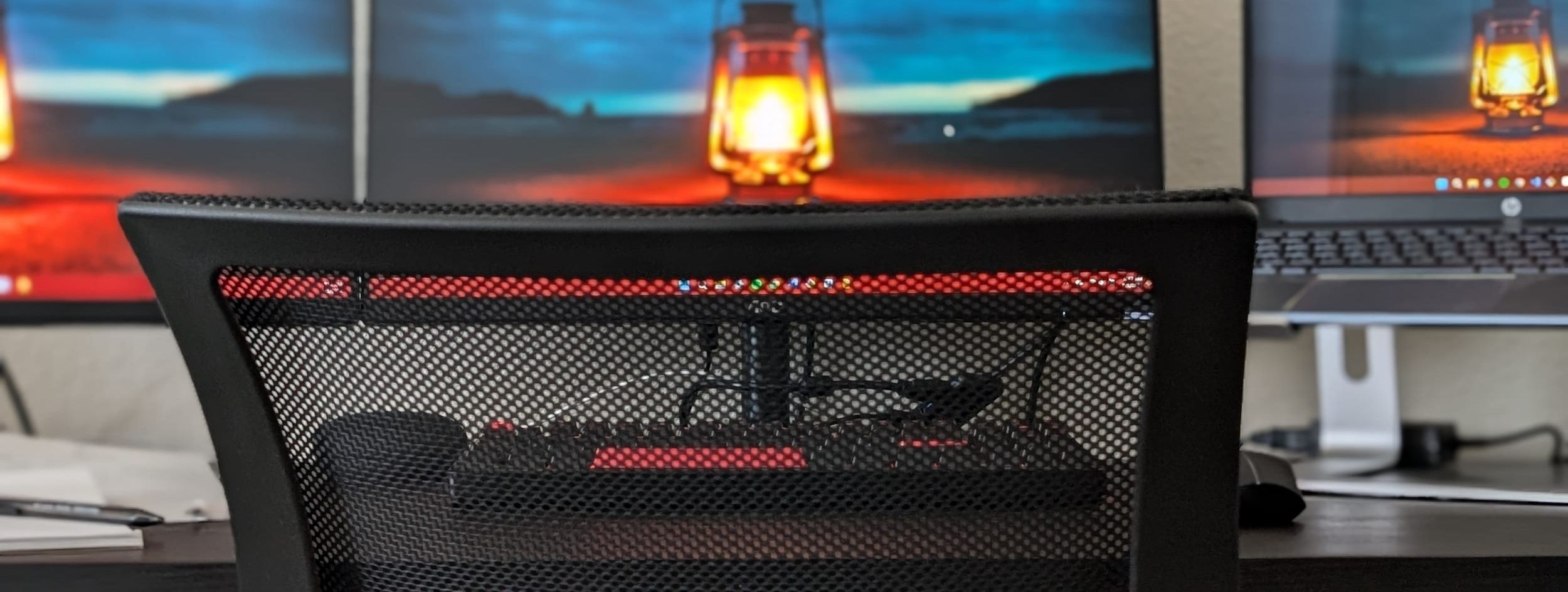 The Lamplighter lantern on the monitors at the desk where our sites are built